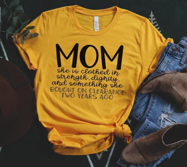 Mom (she is clothed in strength, dignity and something she bought on clearance two years ago)